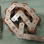 Прижимная роликовая цепь поручня эскалатора, OTIS 506 NCE, 10 роликов (тип Z3), шаг - 78 мм, с кронштейном